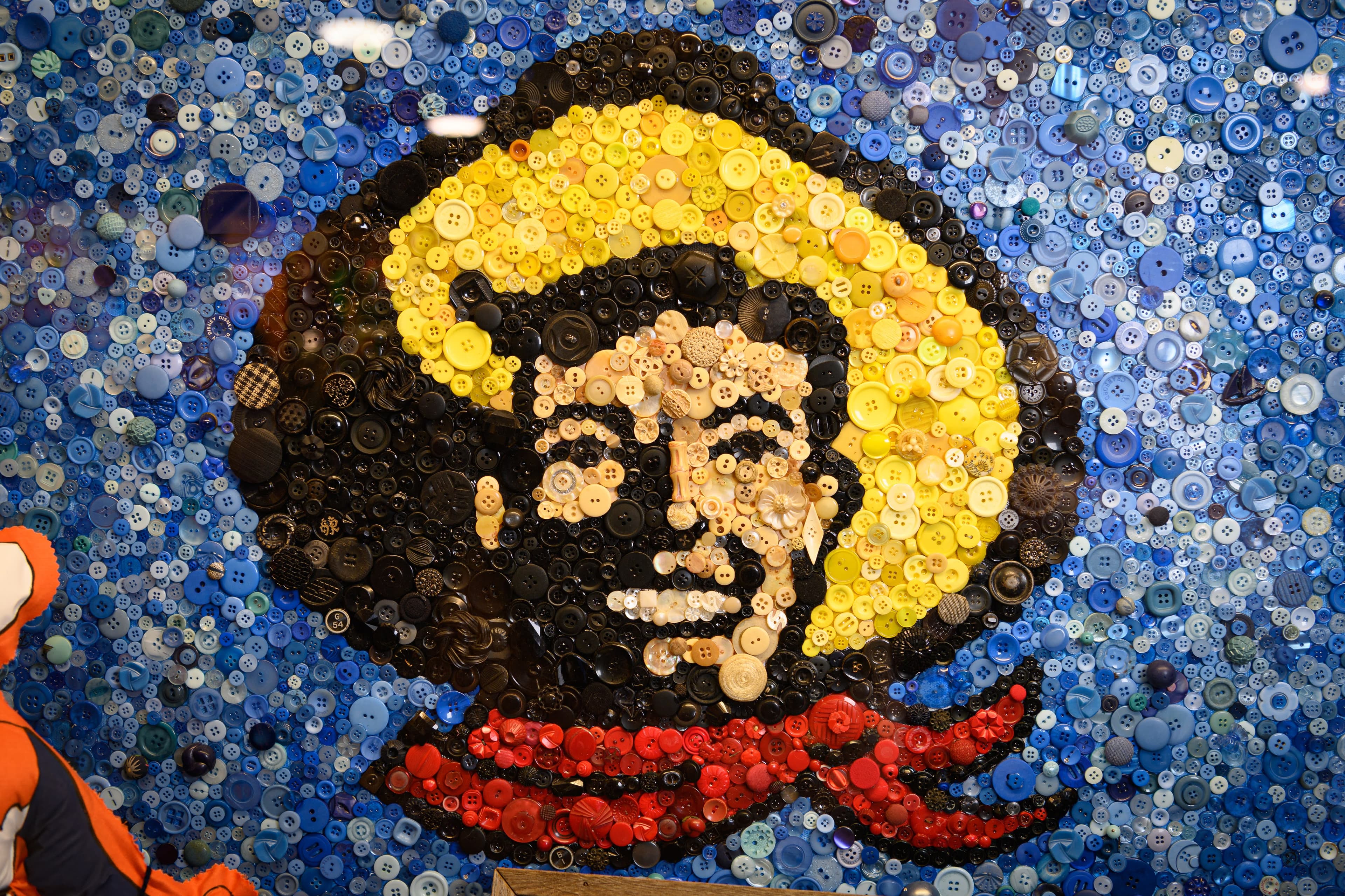 File photo: A cowboy portrait is assembled from multicolored buttons.